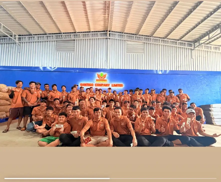 Santigo factory team in front of raw cashew stock